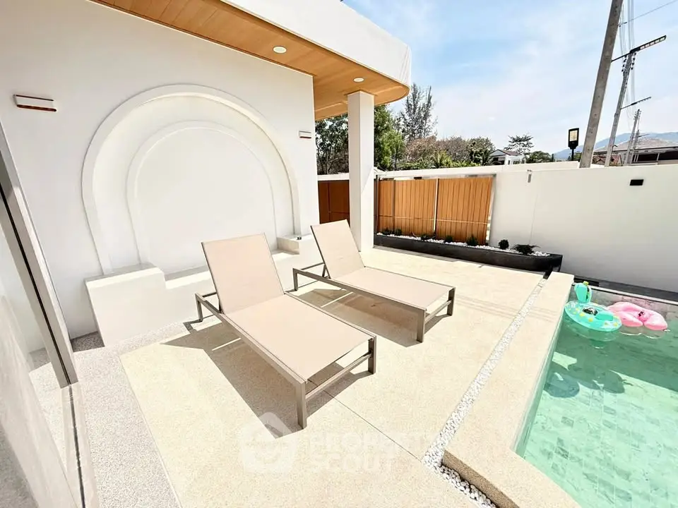Luxurious outdoor pool area with stylish loungers and modern design, perfect for relaxation and entertainment.