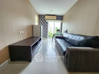 Modern living room with sleek furniture and large window view