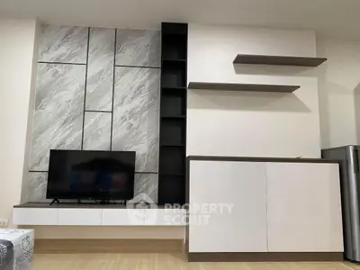 Modern living room with sleek TV unit and stylish shelving