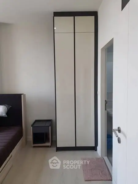 Modern bedroom with sleek wardrobe and minimalist design