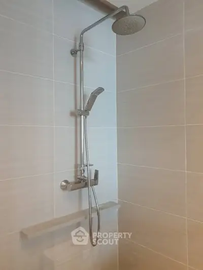 Modern bathroom shower with sleek design and neutral tiles