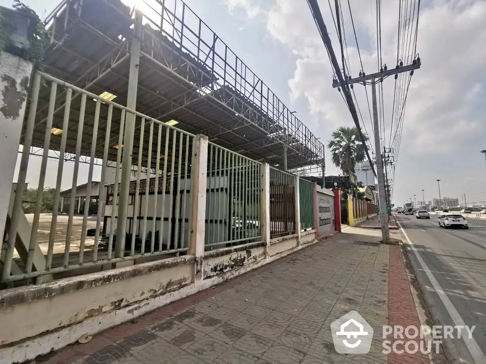 Industrial property exterior with metal structure and street view