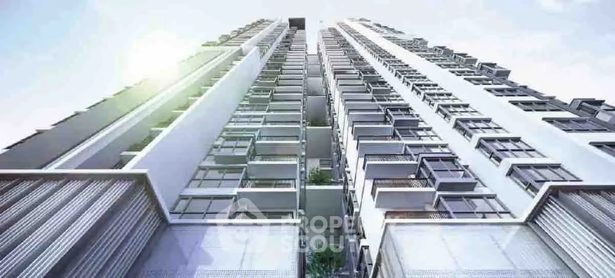 Stunning modern high-rise building with sleek architectural design and expansive balconies.