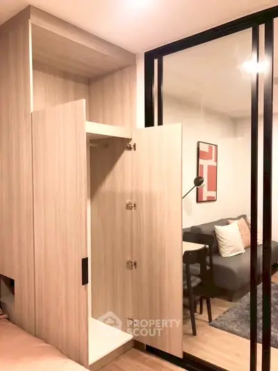 Modern apartment interior with open storage and cozy living area