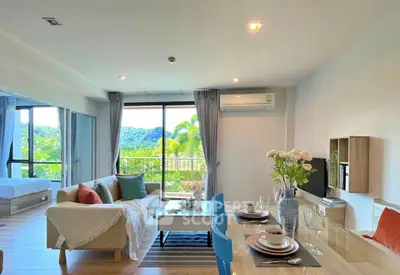 Spacious open-plan living room with dining area and scenic view