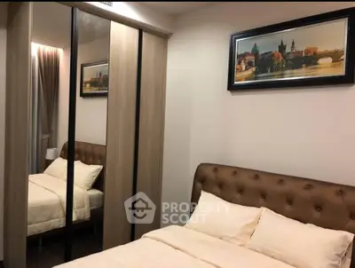 Cozy bedroom with mirrored wardrobe and elegant decor