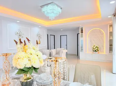 Luxurious living room with elegant decor and modern chandelier