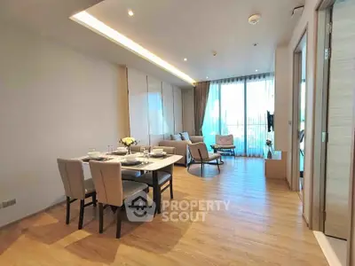 Spacious modern living room with elegant dining area and large windows