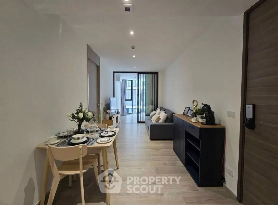 Modern living room with dining area and sleek decor in a stylish apartment
