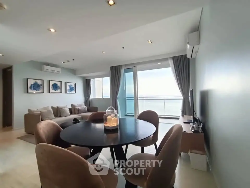 Spacious living room with ocean view and modern dining area