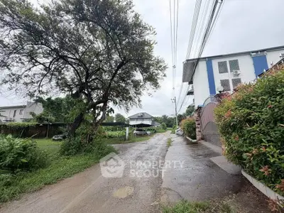 Charming residential area with lush greenery and spacious surroundings, perfect for serene living.