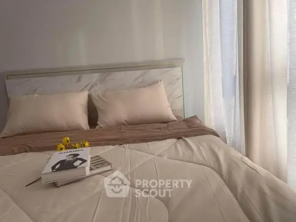 Cozy bedroom with elegant bedding and soft natural light