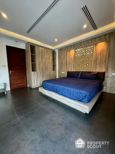 Luxurious modern bedroom with stylish wooden accents and elegant lighting