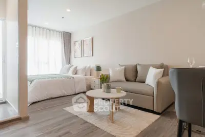 Modern studio apartment with cozy living area and stylish decor