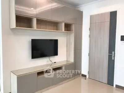 Modern living room with sleek TV unit and stylish cabinetry