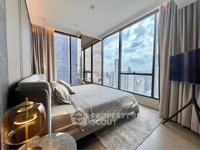 Luxurious bedroom with floor-to-ceiling windows offering stunning city views in a modern high-rise apartment.