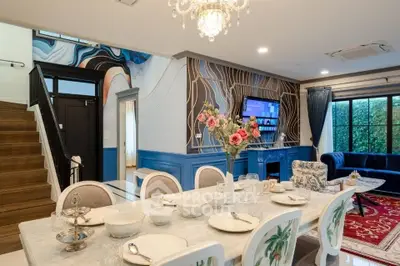 Luxurious dining room with elegant decor and modern furnishings, perfect for entertaining guests.