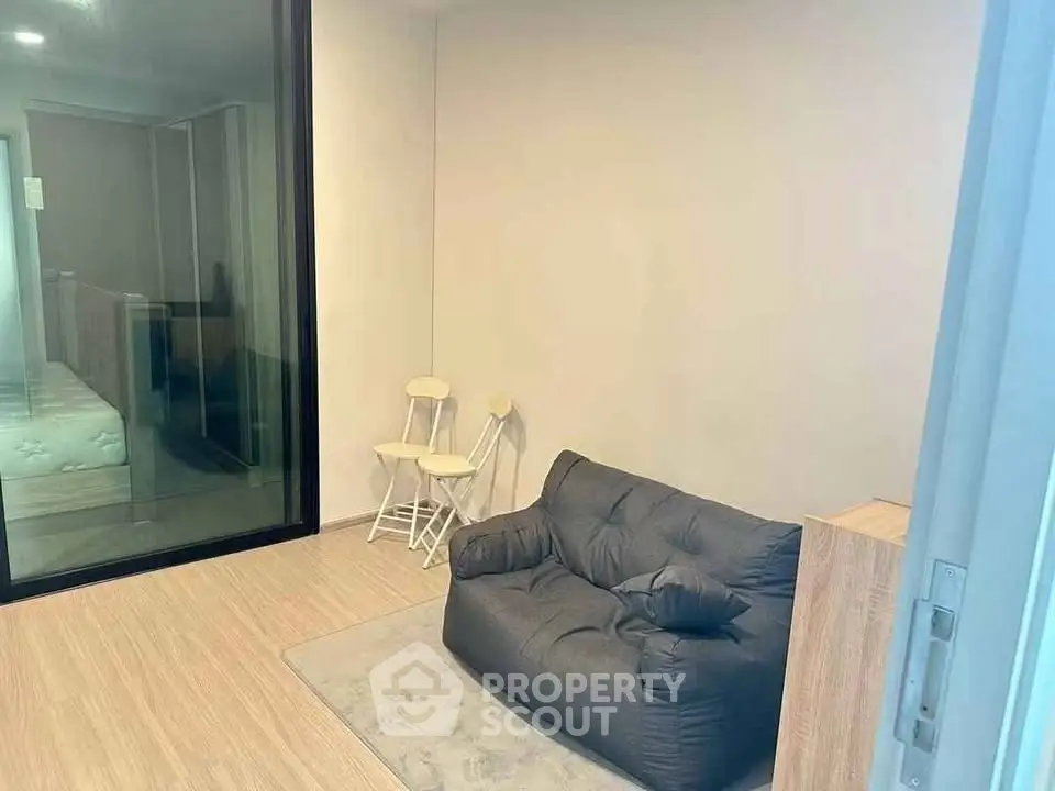 Cozy modern living room with plush seating and minimalist decor, perfect for relaxation.