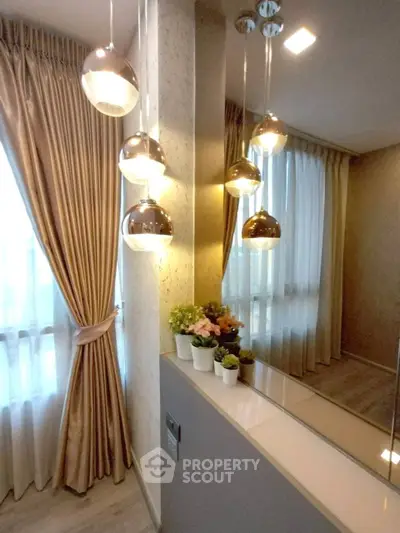 Elegant interior with modern lighting and stylish curtains in a cozy living space.