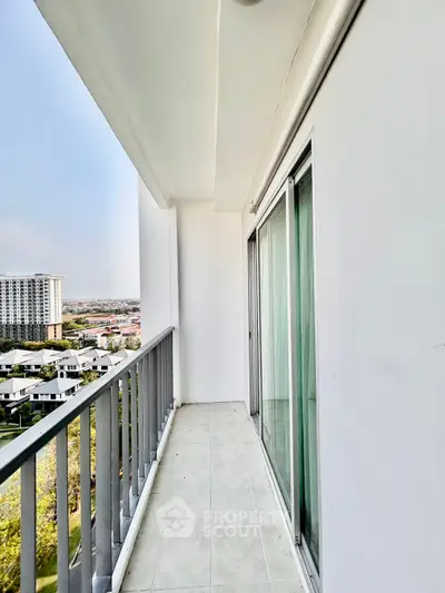 Spacious balcony with stunning city view in modern apartment