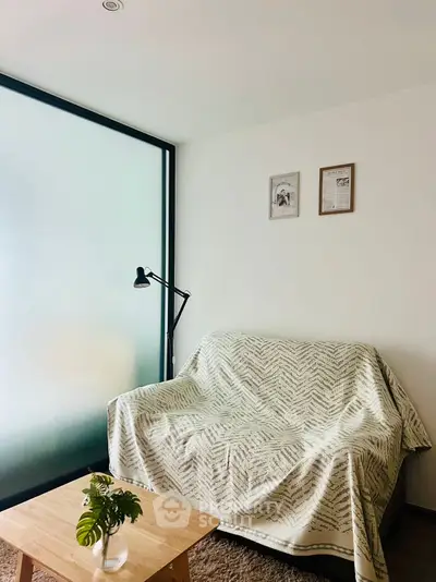 Cozy living room with frosted glass window and stylish decor