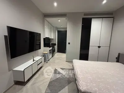 Modern bedroom with sleek TV setup and stylish storage solutions