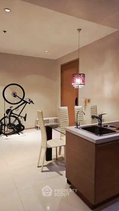 Modern dining area with sleek furniture and bicycle decor