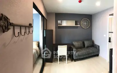 Modern living room with stylish decor and cozy seating in a contemporary apartment.