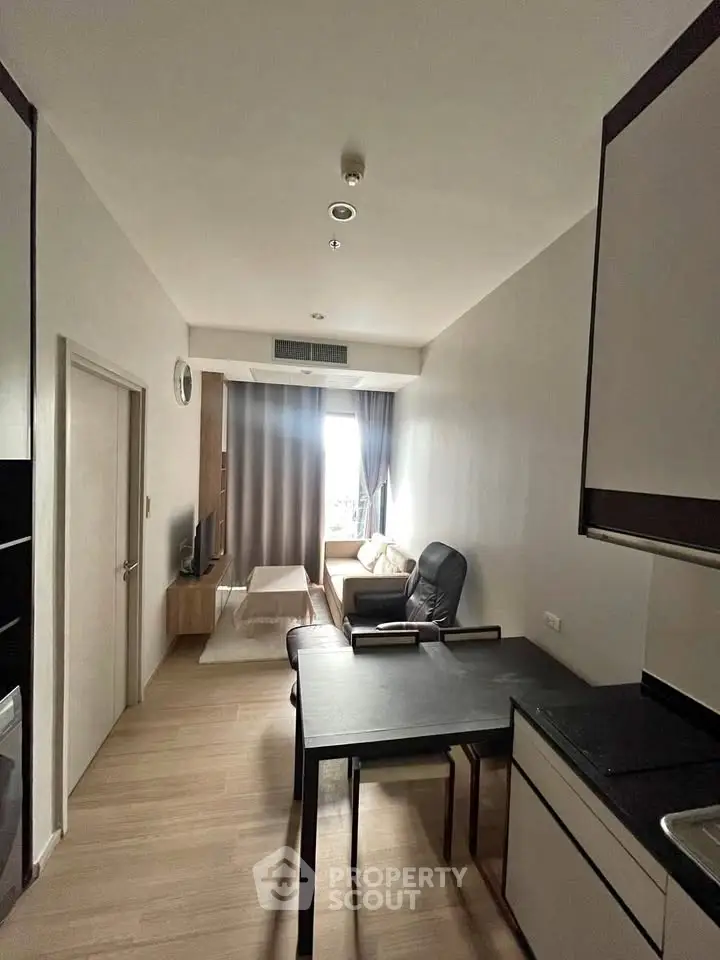 Modern living room with sleek furniture and open layout, perfect for urban living.