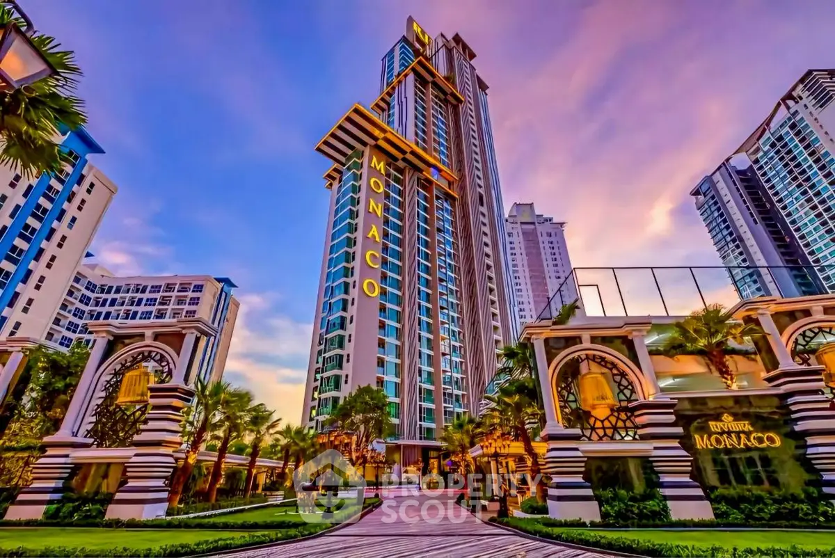 Luxurious high-rise building with stunning architecture and vibrant sunset backdrop.