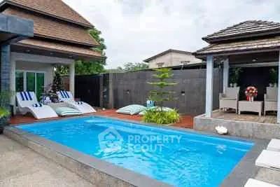 Luxurious villa with private pool and stylish outdoor seating area