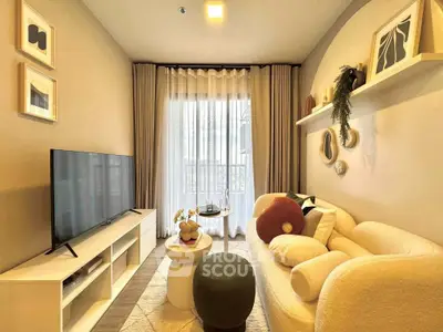 Cozy living room with modern decor and large TV, perfect for relaxation.