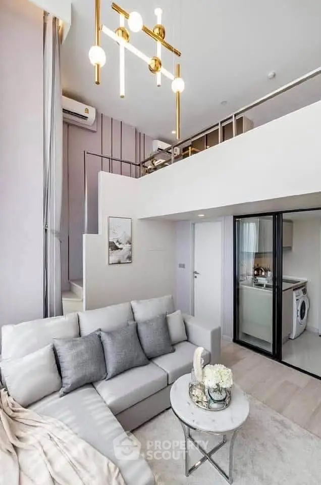 Modern loft apartment with stylish living room and open kitchen layout