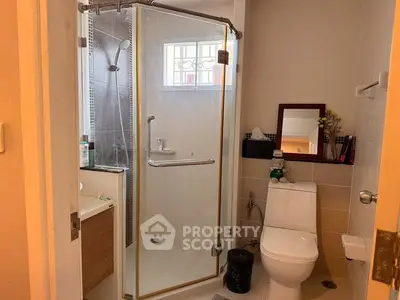 Modern bathroom with glass shower and sleek fixtures
