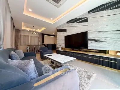 Luxurious modern living room with elegant decor and spacious seating area.