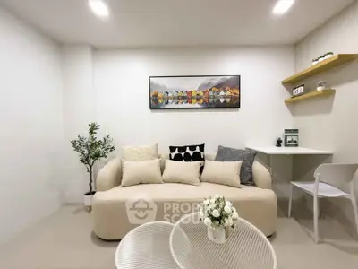 Modern living room with cozy sofa and stylish decor