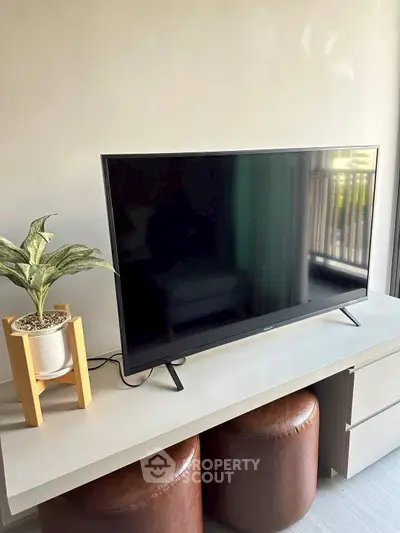 Modern living room with sleek TV and stylish decor