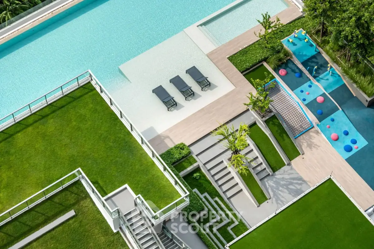 Luxurious rooftop pool and garden with modern design and vibrant play area.