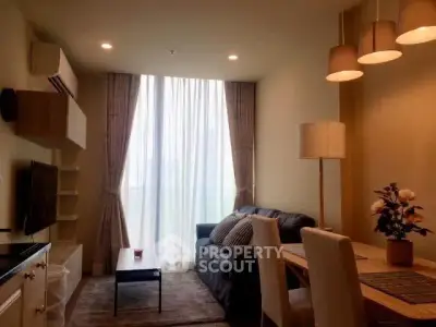 Cozy living room with modern decor and natural light, perfect for relaxation and entertaining.