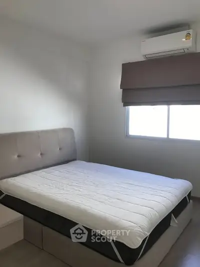 Cozy bedroom with modern air conditioning and natural light