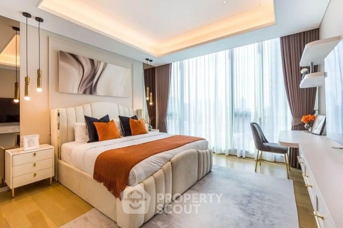 Luxurious modern bedroom with elegant decor and large windows for natural light.
