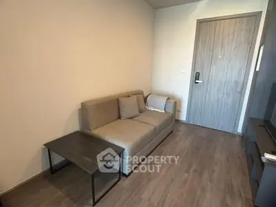 Cozy living room with modern sofa and wooden flooring