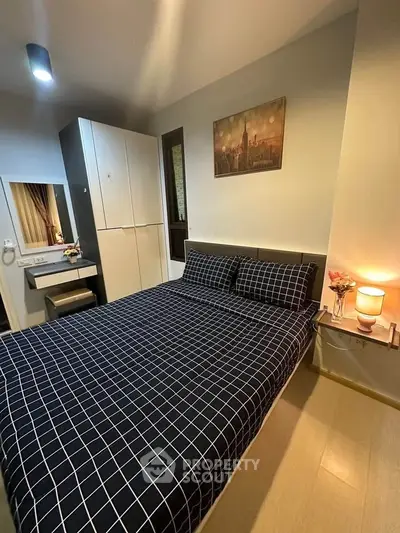 Cozy bedroom with modern decor and stylish checkered bedding