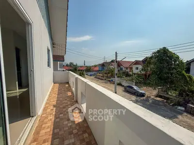 Spacious balcony with scenic neighborhood view, perfect for relaxation and outdoor enjoyment.