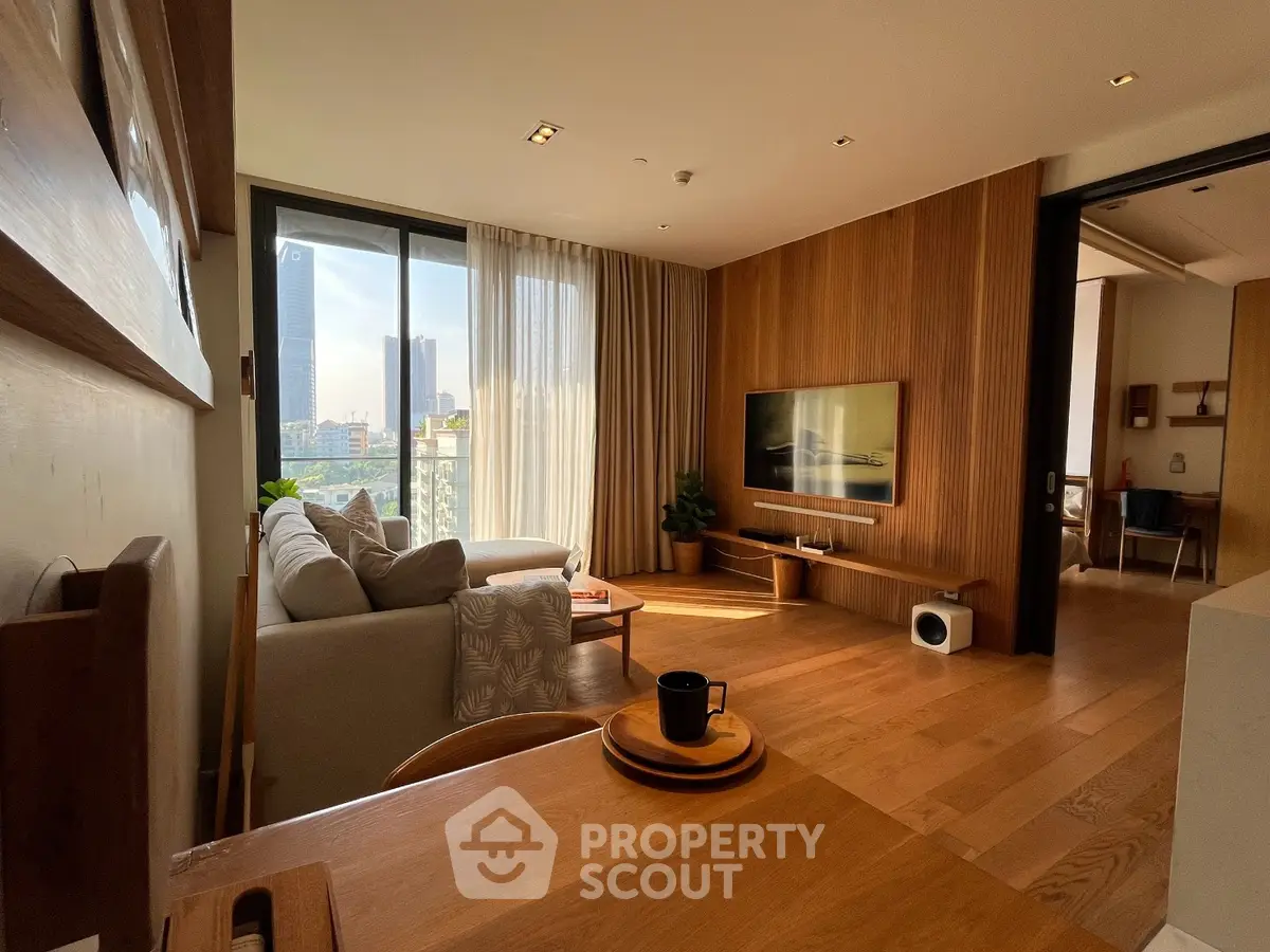 Modern living room with wooden accents and city view, featuring cozy seating and stylish decor.