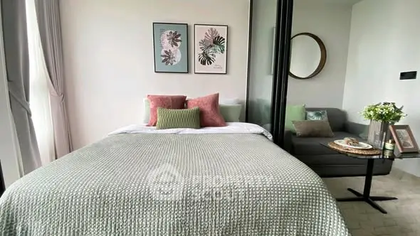 Cozy bedroom with stylish decor and a comfortable bed, perfect for relaxation.