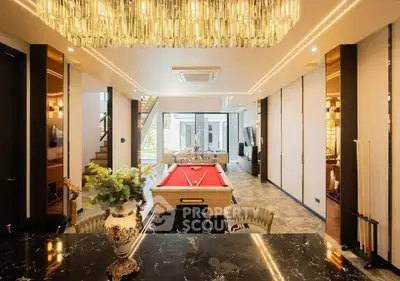 Luxurious modern living room with pool table and elegant lighting