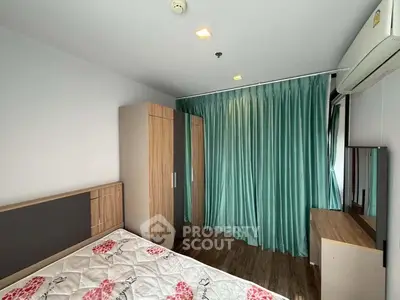Modern bedroom with stylish wardrobe and air conditioning in a cozy apartment.