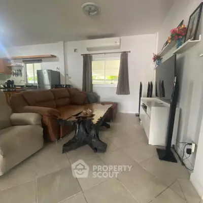 Cozy living room with stylish furniture and modern decor, perfect for relaxation and entertainment.