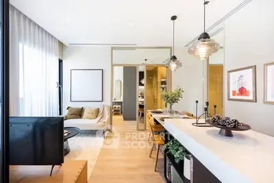 Modern open-plan living room with stylish decor and natural light